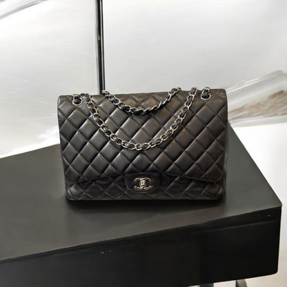 Chanel Black Calfskin Quilted Single Flap Maxi Classic Handbag.